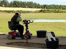 man sitted on mobility scooter
